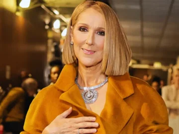 Céline Dion bei emotionalem Bühnenauftritt, Symbol für ihre Rückkehr mit neuen Konzerten in Paris